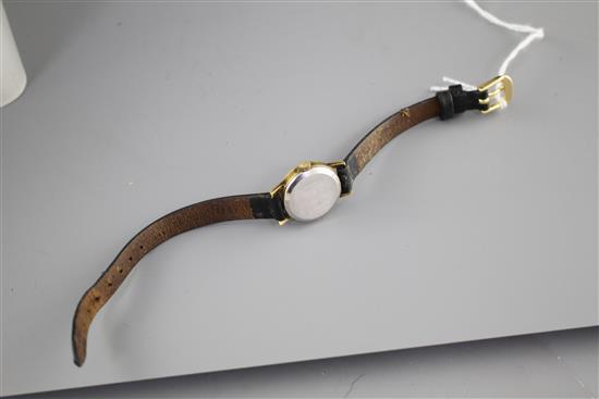 A ladys steel and gold plated Omega manual wind wrist watch, on associated leather strap.